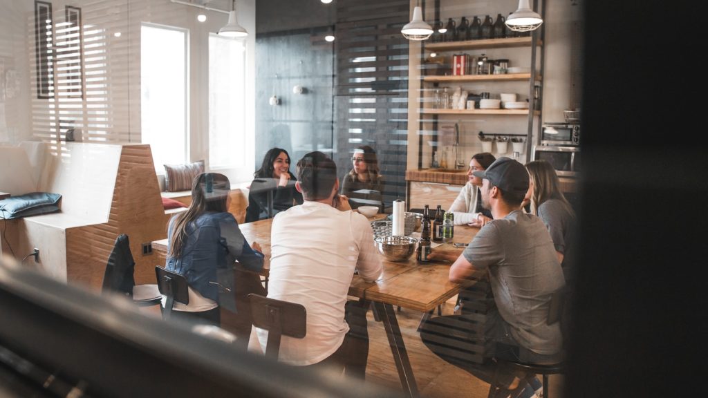 people sitting on chairs in meeting